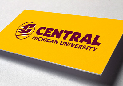 Central Michigan University's Action C Combination mark, the logo with the words "Central Michigan University", in maroon on gold paper.