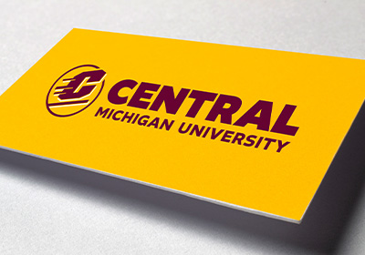 Central Michigan University's Action C Combination mark, the logo with the words Central Michigan University, in maroon on gold paper.