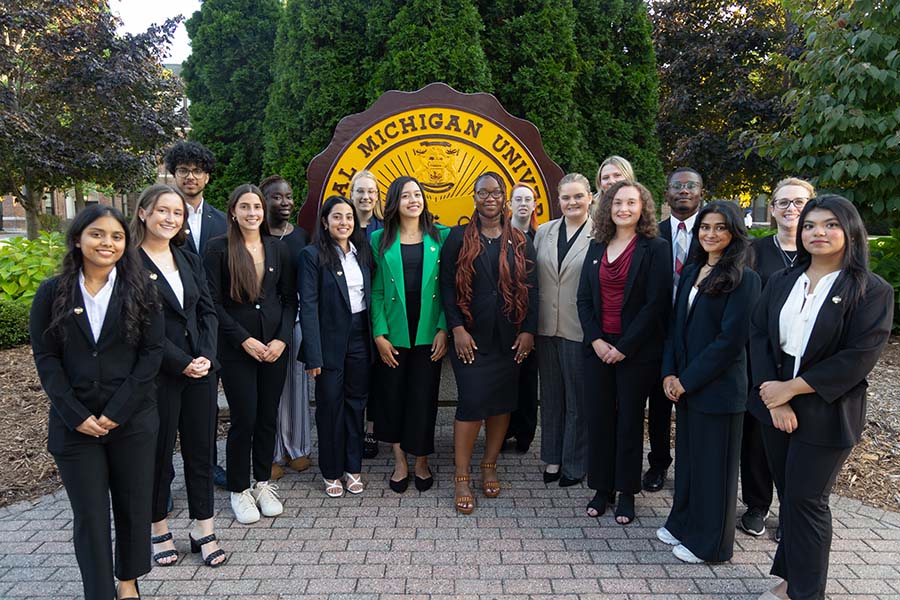 24-09-16 SGA Cabinet Photos EM-72 Student Government Association group photo by the Central Michigan University Seal on Warriner Mall in front of Warriner Hall.