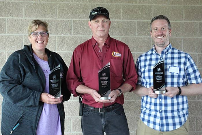 Jennifer Stilwell, Troy Bongard, and Jason Kiley pose with their 2024 Standing Ovation Awards.