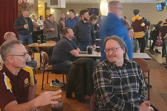 Kurt and Greg share a laugh while watching colleagues bowl at Riverwood.
