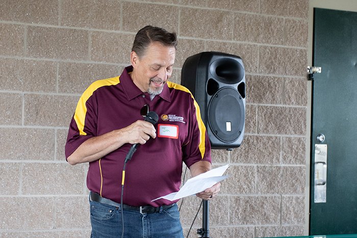 Jim Bujaki laughs during his presentation to staff.