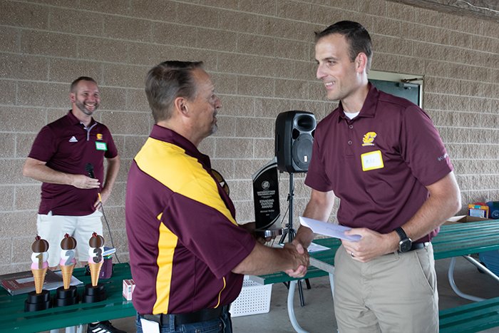 Jim Bujaki presents a Standing Ovation Award to Mike Molter.