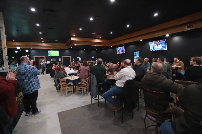 The OIT staff seated at tables listening to the CIO's speech.
