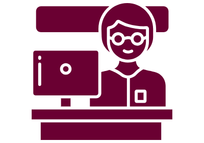 Help Desk navigation card image Person sitting at a desk in front of computer screen