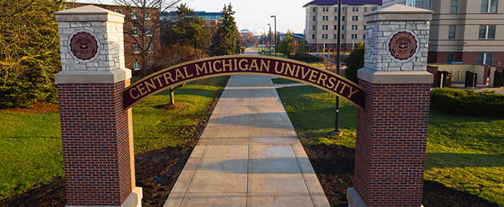 CMU arch with campus buildings in background off Broomfield road