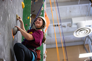 A student participates in rock wall climbing in Finch Fieldhouse on the campus of Central Michigan University. The facility is often used for both child and adult-focused events.
