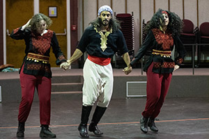 Two women and one man from the Thowra Dabke dance troupe perform a traditional Arab dance often performed at weddings.