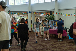 A large group of students check out the tables and displays at a Study Abroad Fair at Central Michigan University.