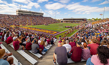 Visiting high school students and supporters attend a Central Michigan University football game in Kelly/Shorts Stadium.