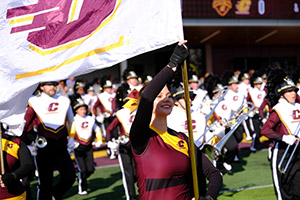 The marching band runs out onto the field for the big Homecoming Football game at Central Michigan University.