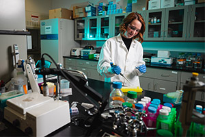 Student researcher working in a lab.