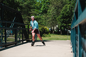 Person rollerblading through a park