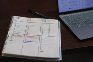 A notebook with different columns of information.