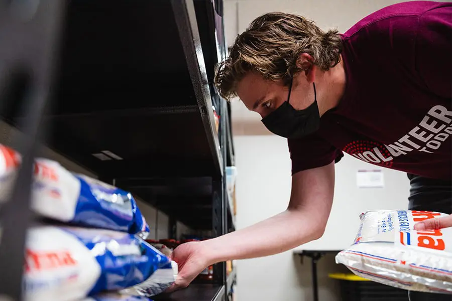 Student getting mail on campus