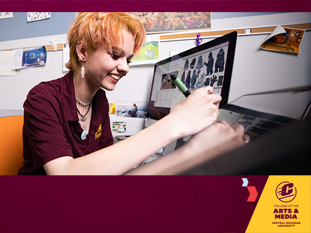 A female student with orange hair and wearing a maroon short sleeve polo, sits in an animation studio sketching on her tablet. The College of Arts and Media logo sits left corner on a gold shape, two chevrons pointing to it on a maroon background.