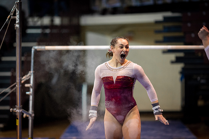 A member of the CMU Gymnastics team celebrates after their nearly flawless performance. CMU went on to defeat Kent State in over-all points.