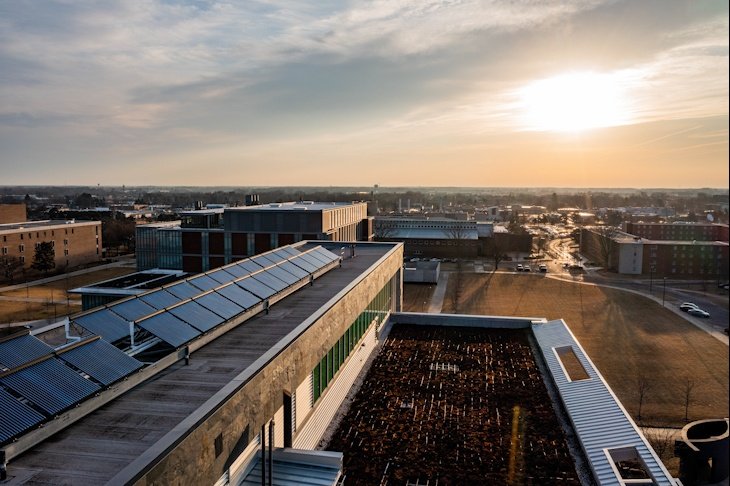 The sun rises behind the Biosciences Building on Thursday.