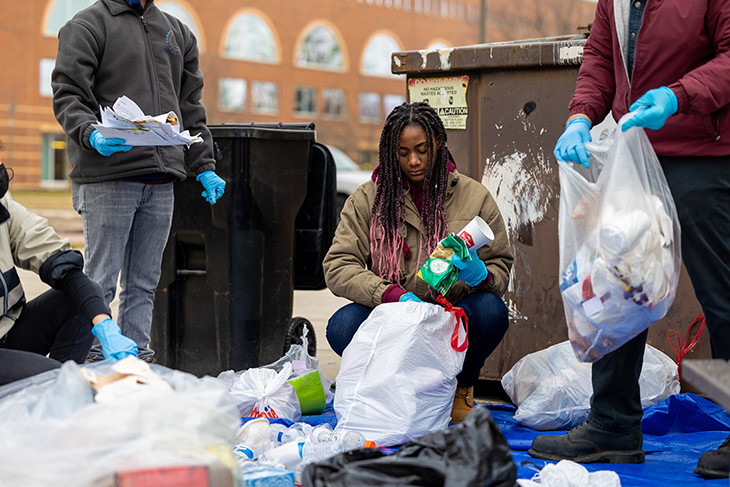 Members of the community and CMU students work in front of the University Center to sort various forms of garbage, pulling out anything that can be composted or recycled. This image was taken in the afternoon of Thursday, April 7.