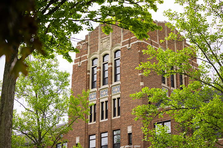 A shot of Warriner Hall on a cloudy summer morning.