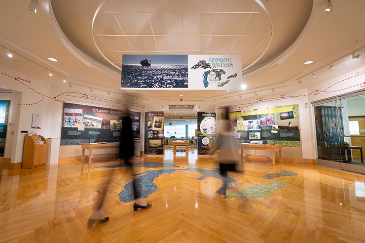 Two students browse the Clarke Historical Library’s “Abundant Waters” exhibition.