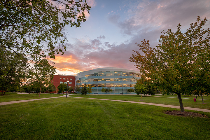 A beautiful sunrise over the Charles V. Park Library.