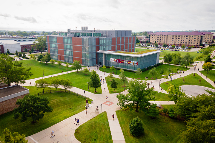 An aerial shot of the BioSciences Building with students walking along sidewalks.