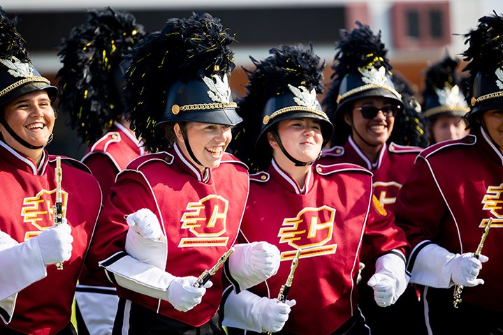 Members of the CMU marching band in full uniform.