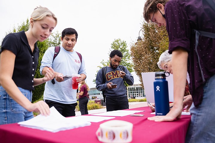 Students look at paperwork during an event hosted by Central Votes.