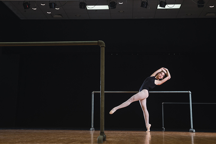 CMU dance student Avery Span does ballet in a black outfit.