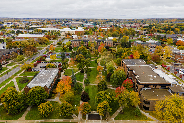 An aerial view of CMU's campus with trees in their full fall colors.