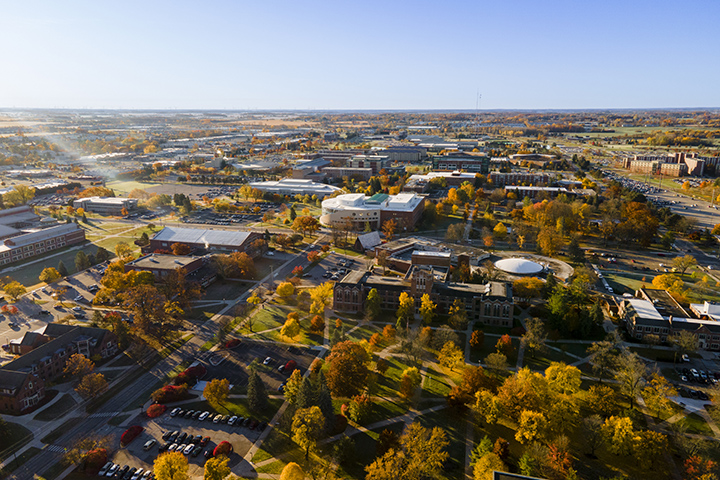 An aerial view of CMU's campus showing beautiful fall colors on the trees.