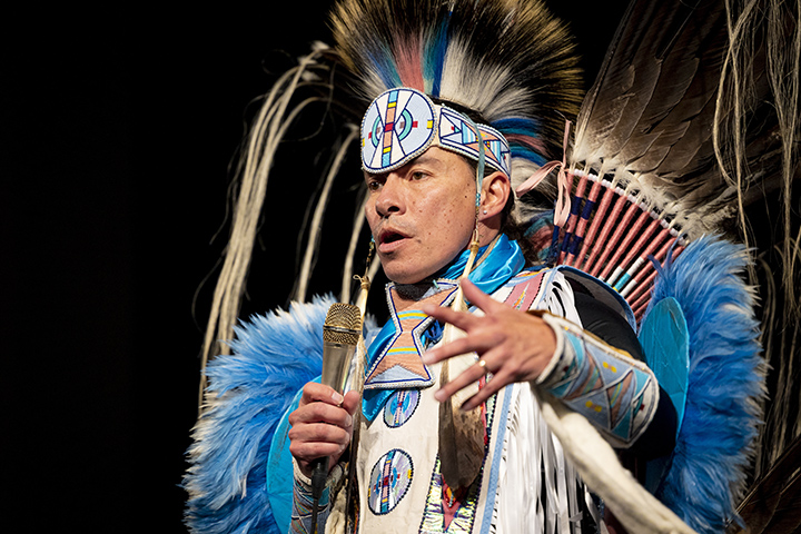 Musical artist Supaman in full Native American attire.