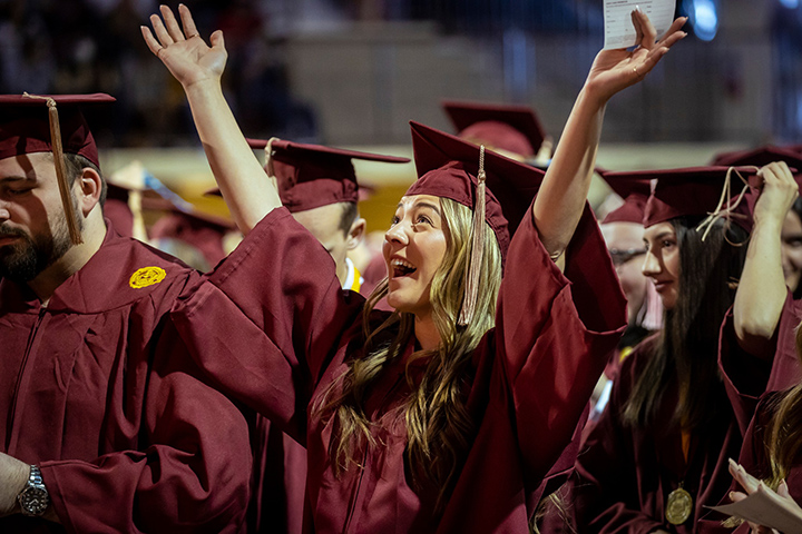 A CMU student celebrates during commencement.