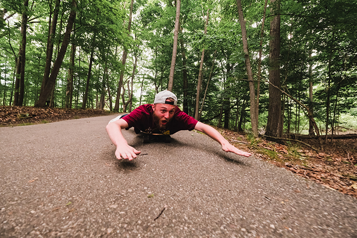 CMU student Michael Armistead finds a thrilling new way to ride his longboard at Chipp-A-Waters Park. This photo was taken on Friday, June 10.