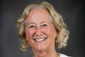 Nancy Mathews, executive vice president and provost at Central Michigan University, poses for a photo with a white blazer.