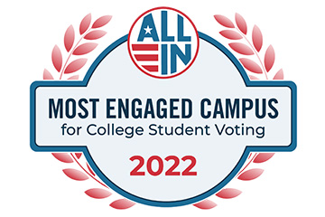 Red leaves surround a circular logo with the words All In Most Engaged Campus for College Voting 2022.