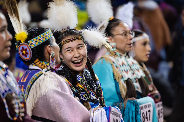 Performers smile at each other during the 2023 Celebrating Life Pow wow.