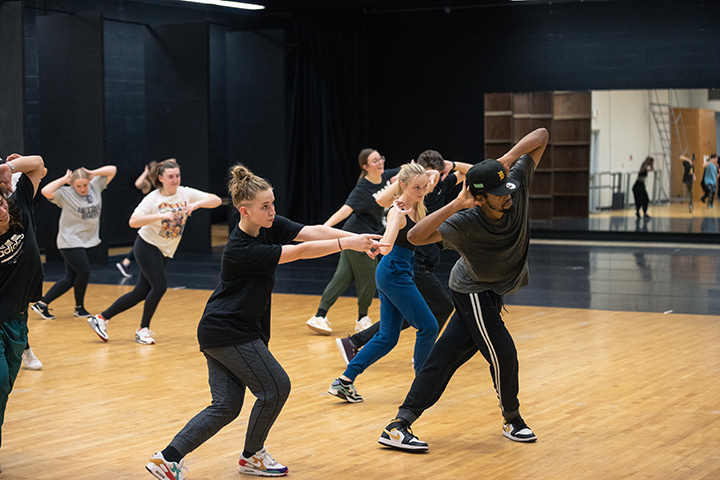 A group of CMU dance students learn hip hop inside the CMU dance studio.