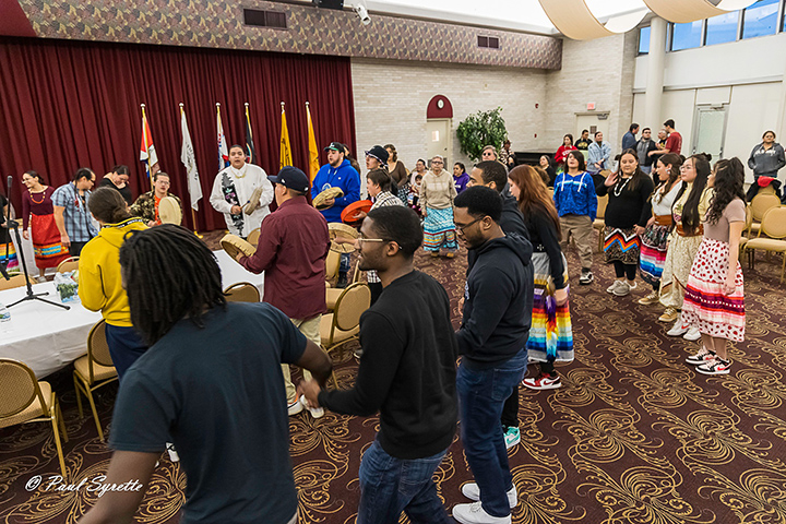 Members of CMU’s North American Indigenous Student Organization dance in the Rotunda Room.