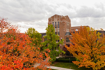 Warriner Hall surrounded by fall colors.