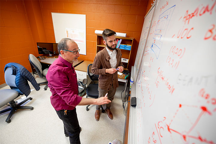 Xander Ault works with faculty mentor Marco Fornari