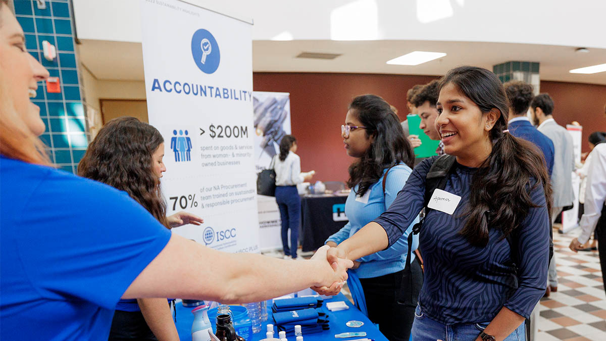 A group of people shaking hands.