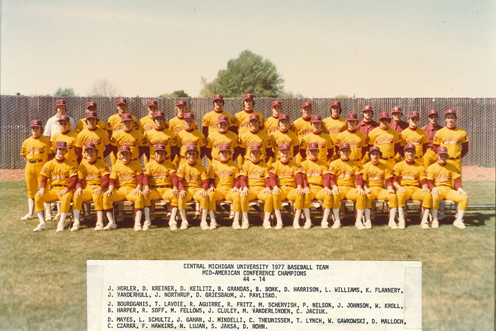 A group of CMU baseball players from 1977 posing for a photo