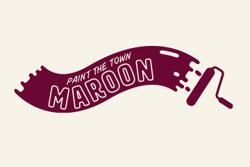 A paint roller is shown painting a wavy, horizontal brush stroke of maroon paint, and the words "PAINT THE TOWN MAROON" are written in white, uppercase letters within the stroke