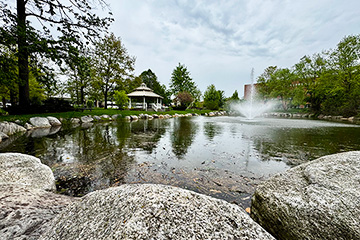 A pond with a fountain in the middle