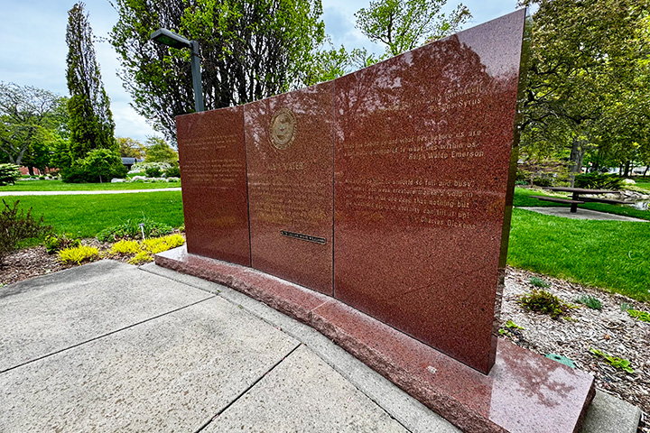 A stone monument with text on it