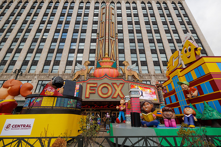 A wide angle view of the CMU parade float as it moves past The Fox Theatre in Downtown Detroit