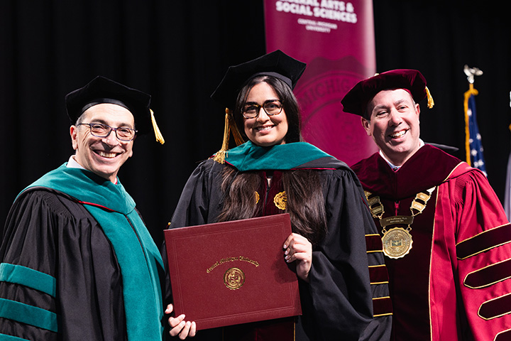 A group of people in graduation gowns and caps