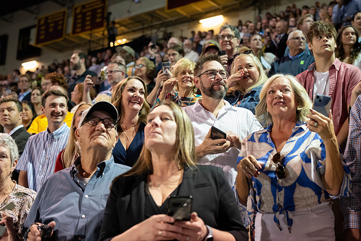 A group of people in a stadium.